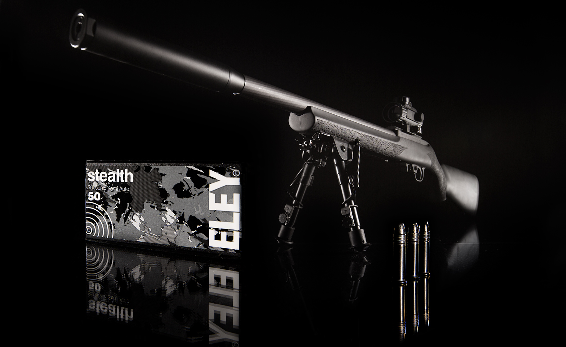 Advertising photography of .22 rifle and ammunition shot in a Warwickshire studio on a black background.