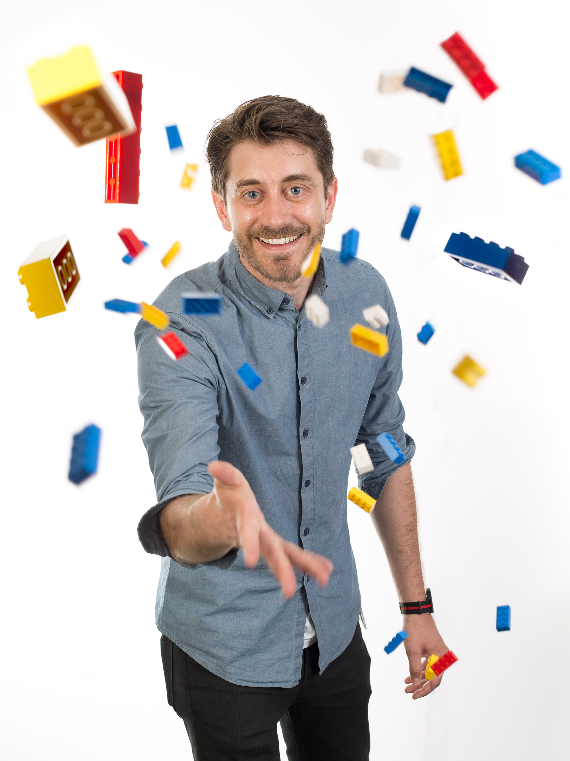 LEGO Speed Champions head of design, Craig Callum throwing bricks during an Editorial Portrait shoot.