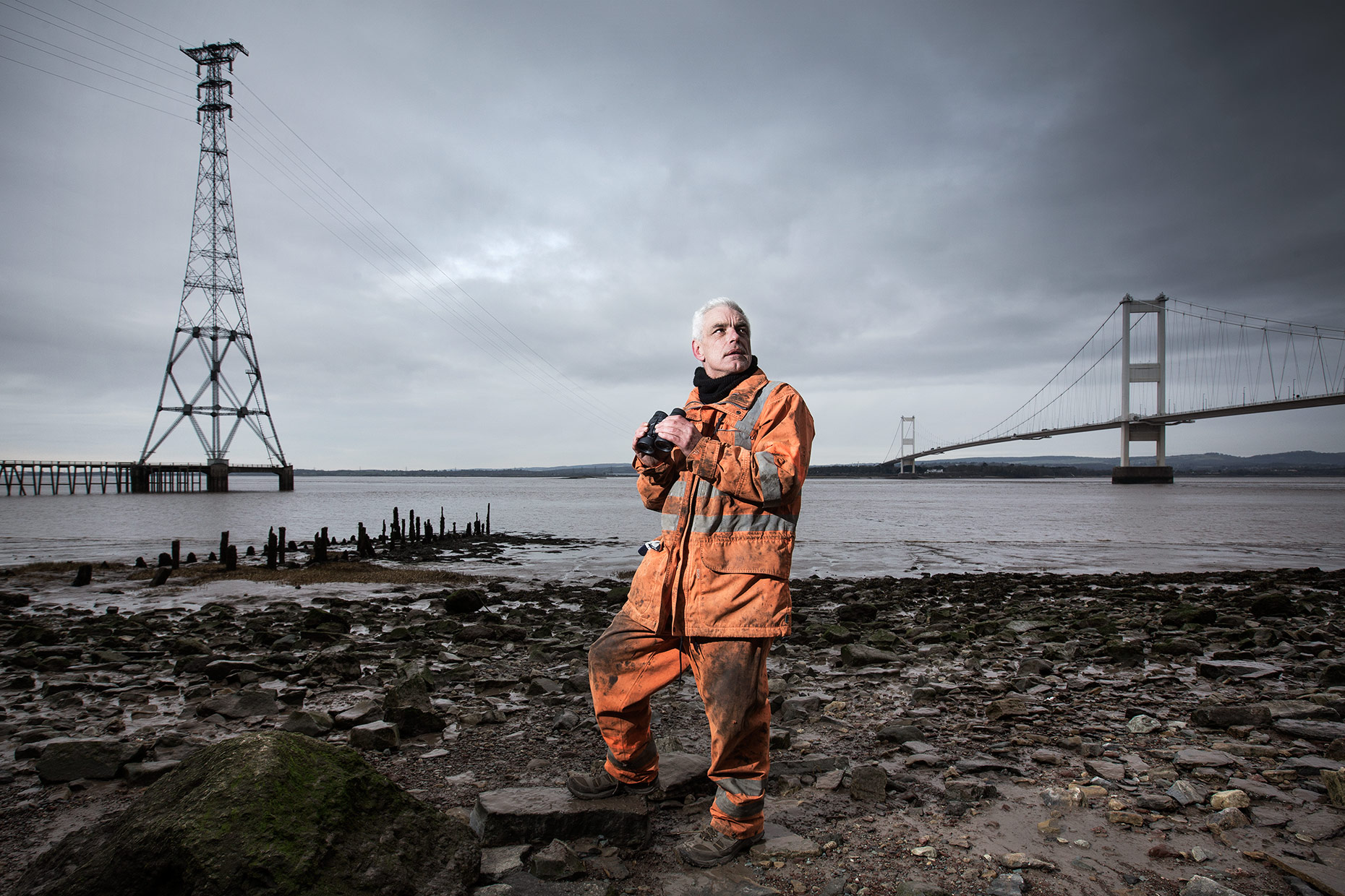 Portrait of linesmen inspecting the electricity cables that cross the Severn Estuary. 