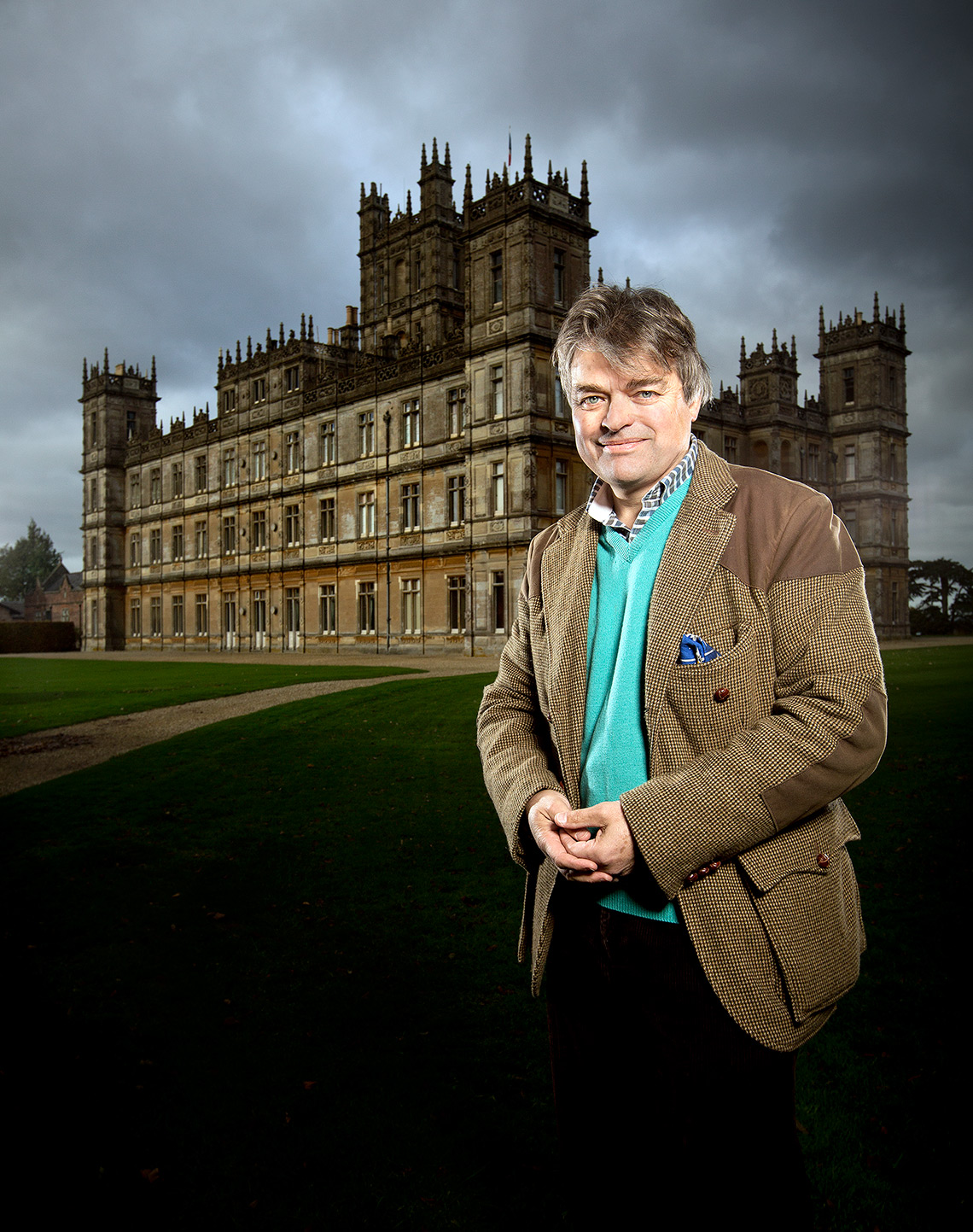 Environmental portrait of Lord Carnarvon outside Highclere Castle the setting for Downton Abbey.